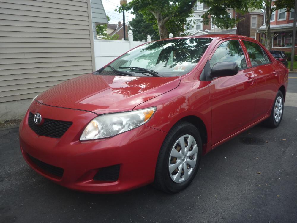 2009 RED /GREY CLOTH Toyota Corolla Base 4-Speed MT (2T1BU40E59C) with an 1.8L L4 DOHC 16V engine, MANUAL transmission, located at 1018 Brunswick Ave, Trenton, NJ, 08638, (609) 989-0900, 40.240086, -74.748085 - Photo #0