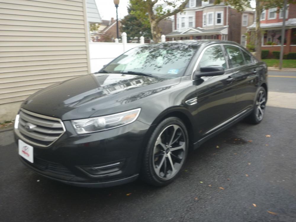 2015 BLACK /BLACK LEATHER Ford Taurus SEL AWD (1FAHP2H84FG) with an 3.5L V6 DOHC 24V engine, 6-Speed Automatic transmission, located at 1018 Brunswick Ave, Trenton, NJ, 08638, (609) 989-0900, 40.240086, -74.748085 - Photo #0