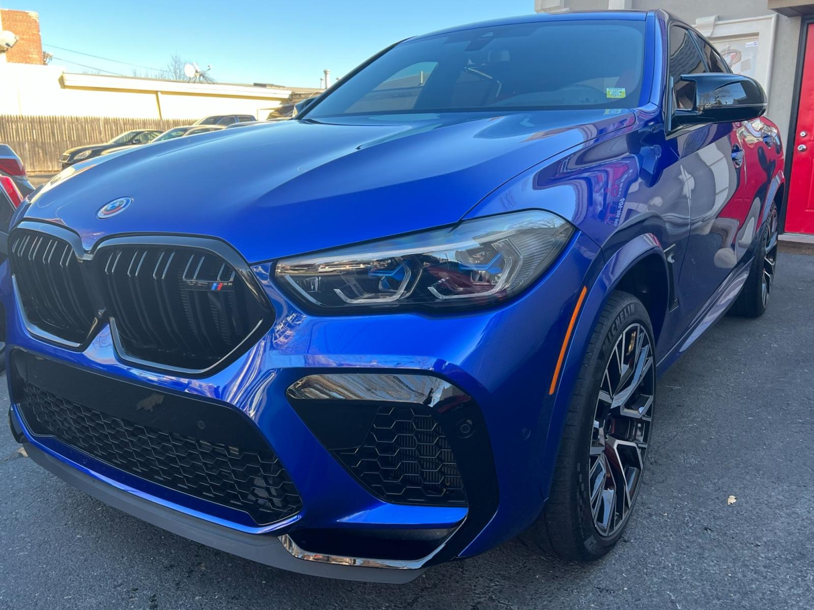 2022 Blue /Red/Black BMW X6 M Base (5YMCY0C07N9) with an 4.4L V8 DOHC 32V engine, 8A transmission, located at 1018 Brunswick Ave, Trenton, NJ, 08638, (609) 989-0900, 40.240086, -74.748085 - Holy Cow and Wow!!...That is the description on this absolutely stunning BMW X6 M Competition! Ordered by Anthony himself with the best color choice of Marina Bay Blue metallic and Red Interior to stand out on the road and to any enthusiast of the BMW X series! Executive Pkg. includes Remote Start, - Photo #2