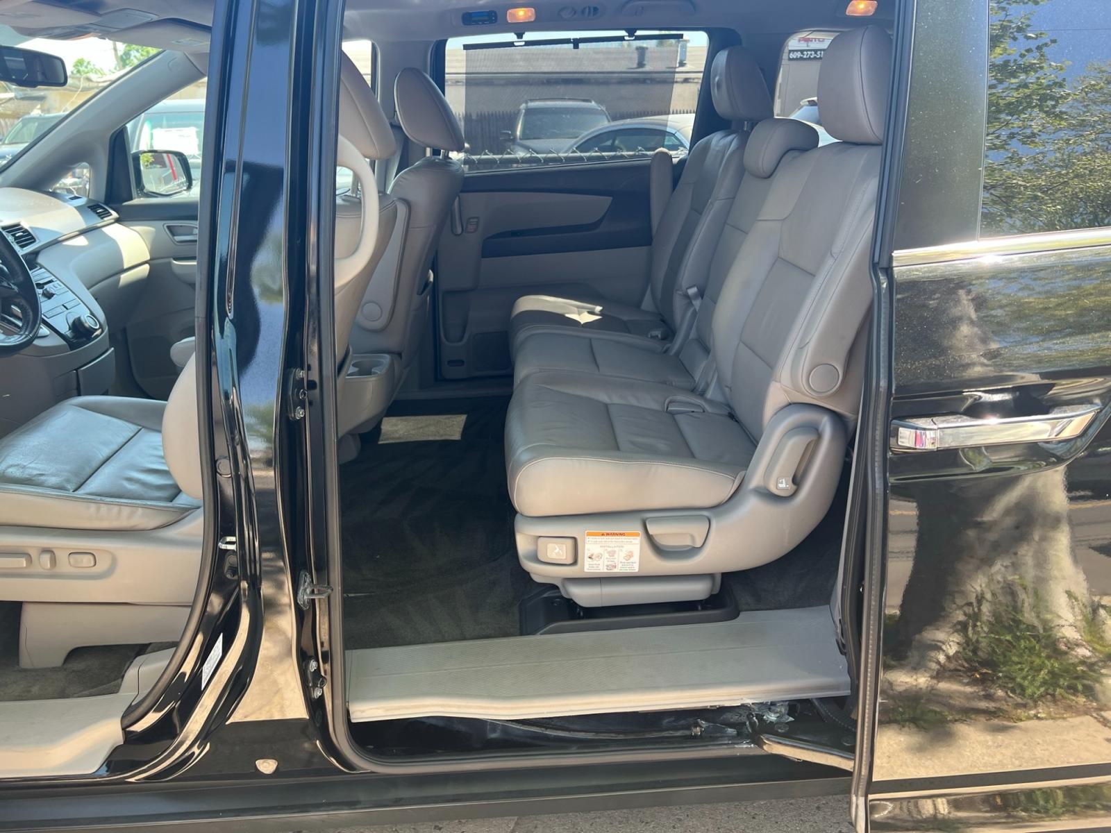 2013 BLACK /grey leather Honda Odyssey EX-L (5FNRL5H64DB) with an 3.5L V6 SOHC 24V engine, 5-Speed Automatic transmission, located at 1018 Brunswick Ave, Trenton, NJ, 08638, (609) 989-0900, 40.240086, -74.748085 - Here is a real nice Honda Odyssey. Fully serviced and ready for the next family roadtrip! Call Anthony to set up a time to see it ASAP! 609-273-5100 - Photo #9