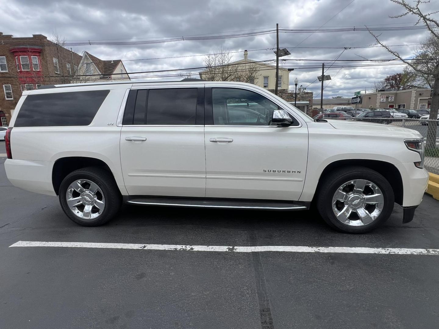 2015 White /Burgundy Chevrolet Suburban LTZ 1500 4WD (1GNSKKKCXFR) with an 5.3L V8 OHV 16V engine, 6-Speed Automatic transmission, located at 1018 Brunswick Ave, Trenton, NJ, 08638, (609) 989-0900, 40.240086, -74.748085 - Photo#1