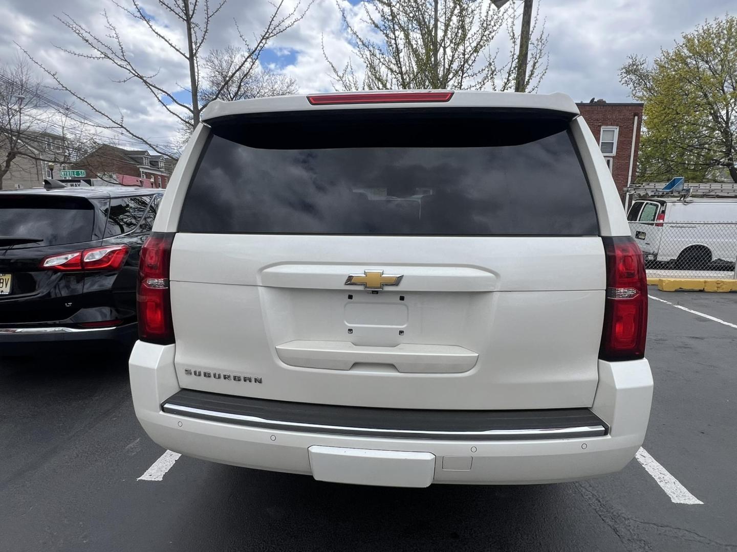 2015 White /Burgundy Chevrolet Suburban LTZ 1500 4WD (1GNSKKKCXFR) with an 5.3L V8 OHV 16V engine, 6-Speed Automatic transmission, located at 1018 Brunswick Ave, Trenton, NJ, 08638, (609) 989-0900, 40.240086, -74.748085 - Photo#5