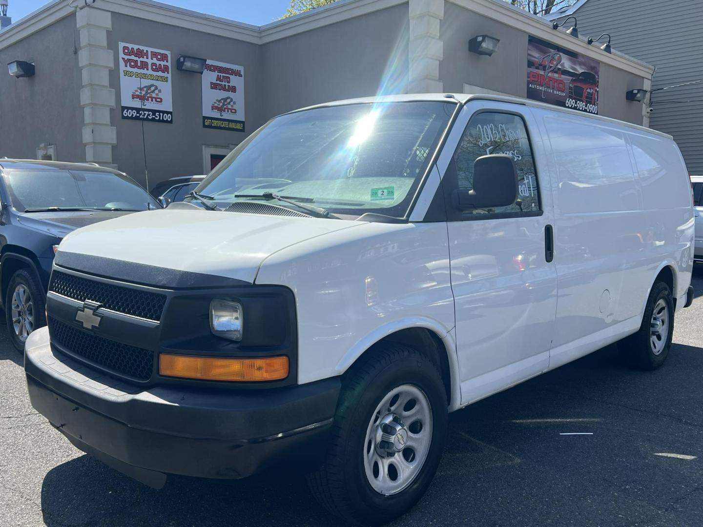 2013 White /Gray Chevrolet Express 1500 Cargo (1GCSGAFX9D1) with an 4.3L V6 OHV 12V engine, 4-Speed Automatic transmission, located at 1018 Brunswick Ave, Trenton, NJ, 08638, (609) 989-0900, 40.240086, -74.748085 - Photo#0