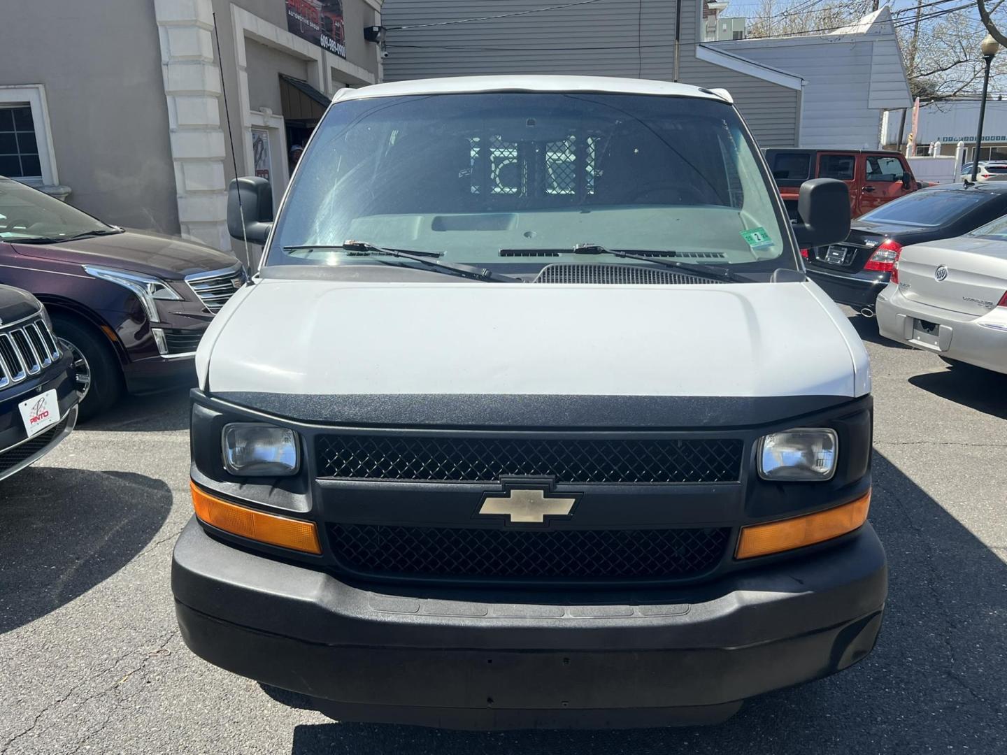 2013 White /Gray Chevrolet Express 1500 Cargo (1GCSGAFX9D1) with an 4.3L V6 OHV 12V engine, 4-Speed Automatic transmission, located at 1018 Brunswick Ave, Trenton, NJ, 08638, (609) 989-0900, 40.240086, -74.748085 - Photo#5