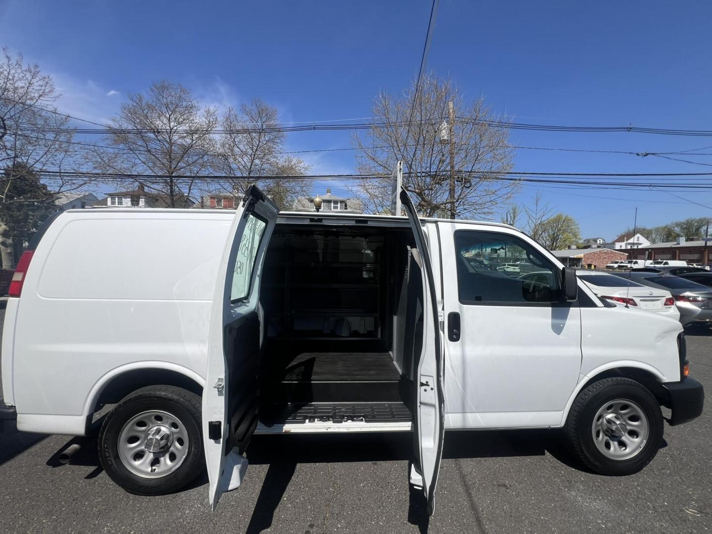2013 White /Gray Chevrolet Express 1500 Cargo (1GCSGAFX9D1) with an 4.3L V6 OHV 12V engine, 4-Speed Automatic transmission, located at 1018 Brunswick Ave, Trenton, NJ, 08638, (609) 989-0900, 40.240086, -74.748085 - Photo#1