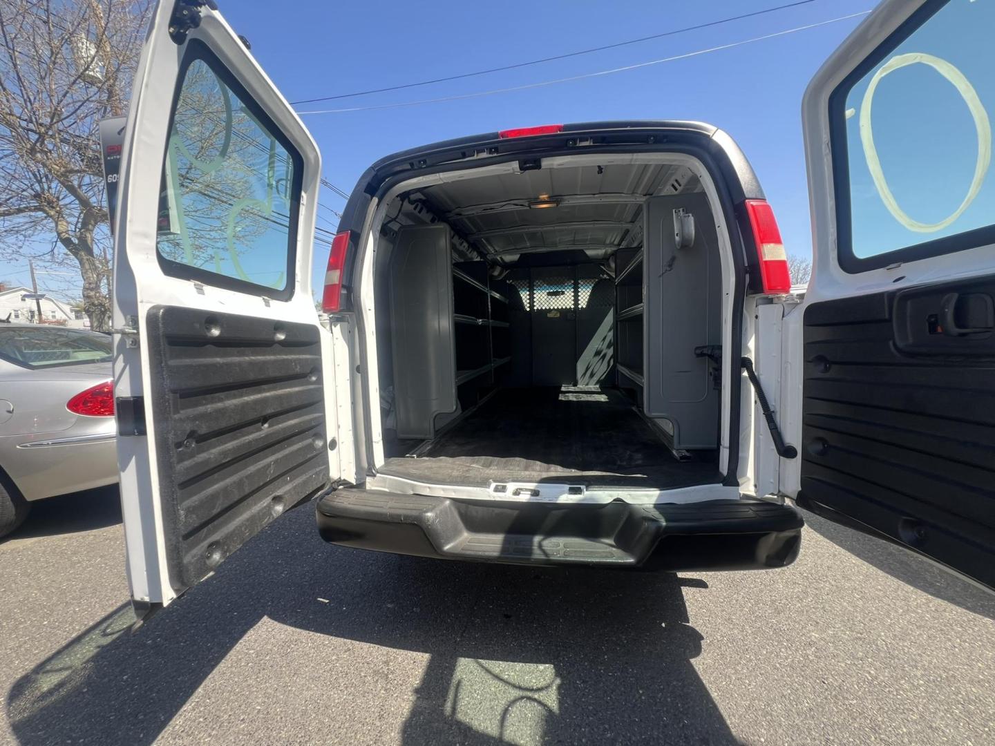 2013 White /Gray Chevrolet Express 1500 Cargo (1GCSGAFX9D1) with an 4.3L V6 OHV 12V engine, 4-Speed Automatic transmission, located at 1018 Brunswick Ave, Trenton, NJ, 08638, (609) 989-0900, 40.240086, -74.748085 - Photo#18