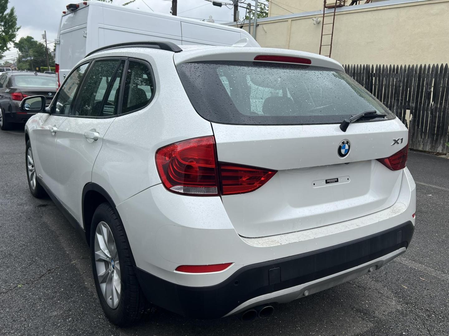 2014 White /Black Leather BMW X1 xDrive28i (WBAVL1C55EV) with an 2.0L L4 DOHC 16V engine, 8-Speed Automatic transmission, located at 1018 Brunswick Ave, Trenton, NJ, 08638, (609) 989-0900, 40.240086, -74.748085 - Photo#5
