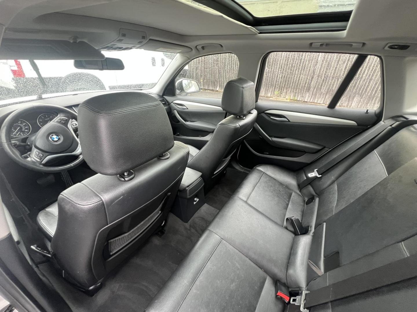 2014 White /Black Leather BMW X1 xDrive28i (WBAVL1C55EV) with an 2.0L L4 DOHC 16V engine, 8-Speed Automatic transmission, located at 1018 Brunswick Ave, Trenton, NJ, 08638, (609) 989-0900, 40.240086, -74.748085 - Photo#14