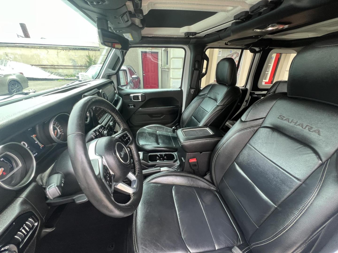 2018 White /Black Leather Jeep Wrangler Unlimited Sahara (1C4HJXENXJW) with an 2.0L L4 DOHC 16V TURBO engine, 6A transmission, located at 1018 Brunswick Ave, Trenton, NJ, 08638, (609) 989-0900, 40.240086, -74.748085 - Photo#11