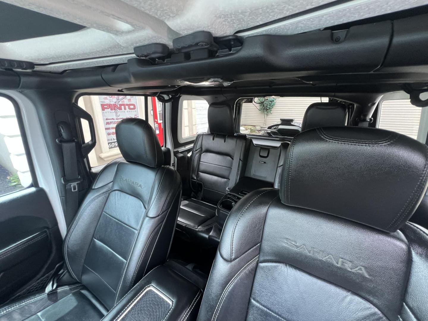 2018 White /Black Leather Jeep Wrangler Unlimited Sahara (1C4HJXENXJW) with an 2.0L L4 DOHC 16V TURBO engine, 6A transmission, located at 1018 Brunswick Ave, Trenton, NJ, 08638, (609) 989-0900, 40.240086, -74.748085 - Photo#14