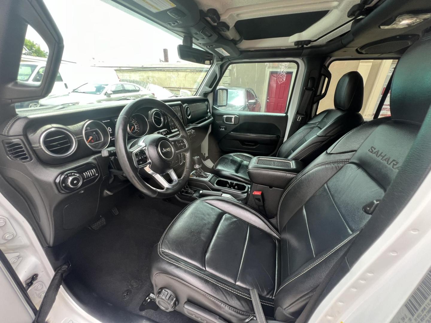 2018 White /Black Leather Jeep Wrangler Unlimited Sahara (1C4HJXENXJW) with an 2.0L L4 DOHC 16V TURBO engine, 6A transmission, located at 1018 Brunswick Ave, Trenton, NJ, 08638, (609) 989-0900, 40.240086, -74.748085 - Photo#15
