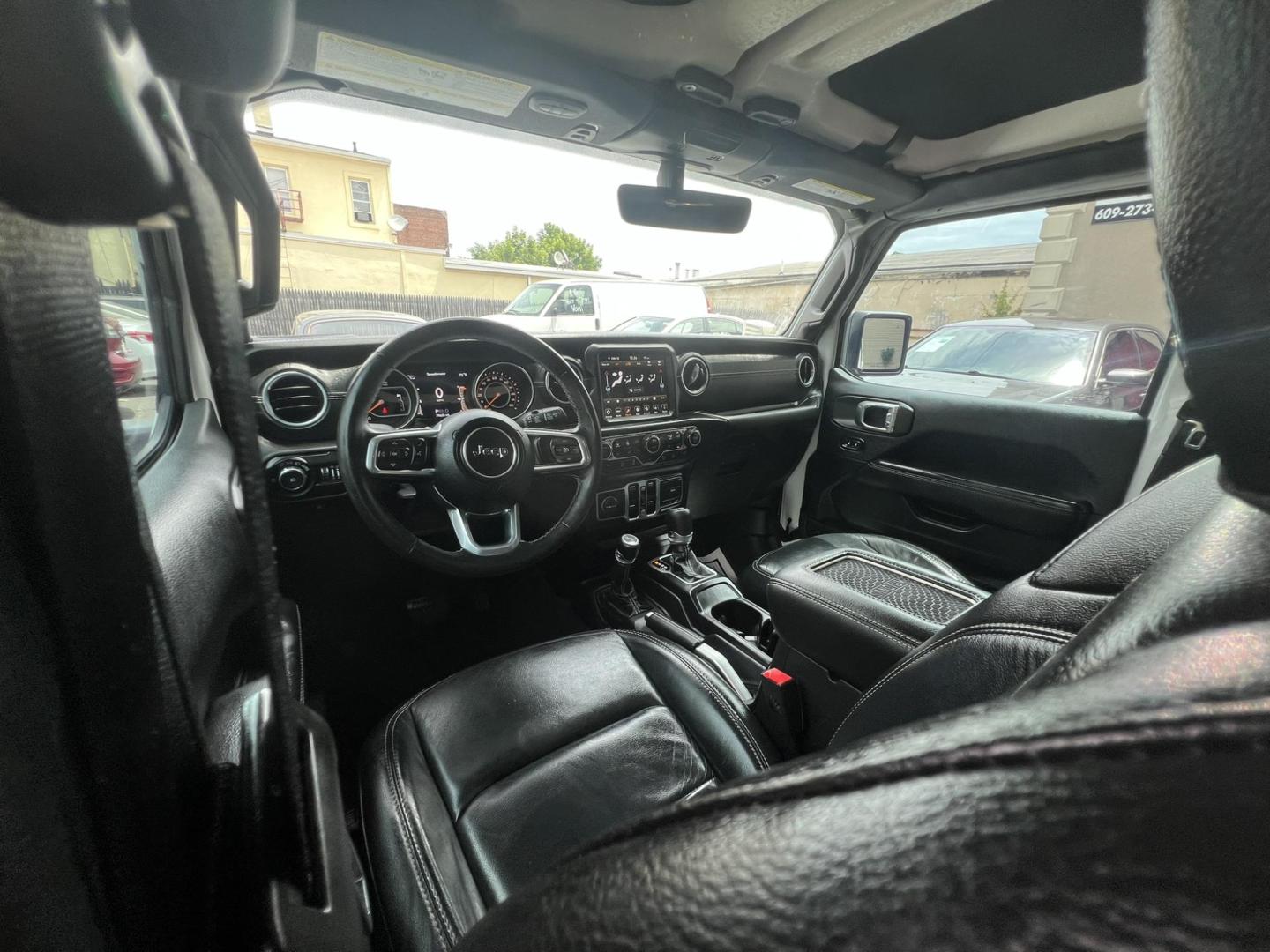 2018 White /Black Leather Jeep Wrangler Unlimited Sahara (1C4HJXENXJW) with an 2.0L L4 DOHC 16V TURBO engine, 6A transmission, located at 1018 Brunswick Ave, Trenton, NJ, 08638, (609) 989-0900, 40.240086, -74.748085 - Photo#17