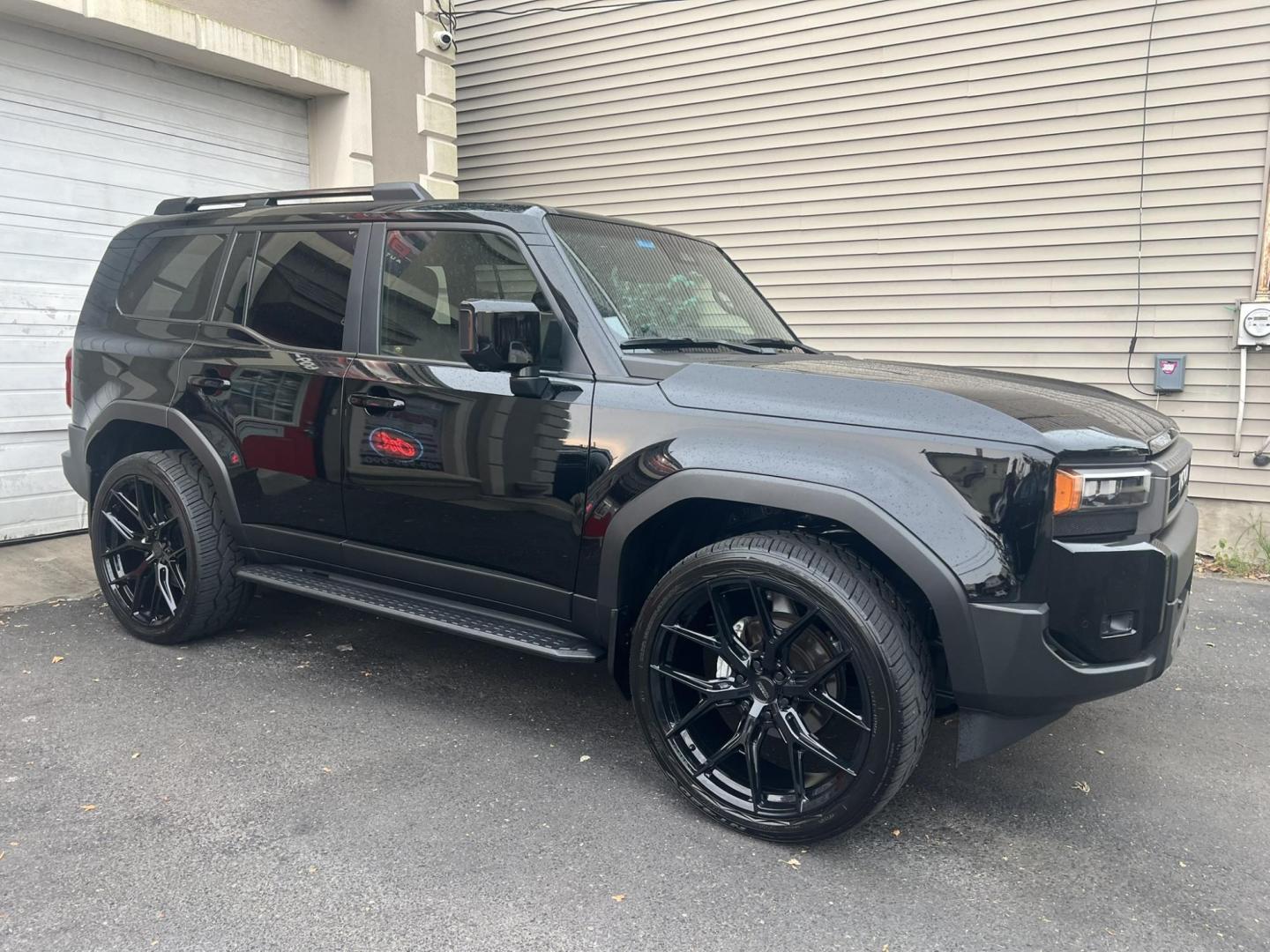 2024 BLACK /Black Leather Toyota Land Cruiser Base (JTEABFAJ7RK) with an 2.4L L4 DOHC 16V PLUG-IN HYBRID engine, 8A transmission, located at 1018 Brunswick Ave, Trenton, NJ, 08638, (609) 989-0900, 40.240086, -74.748085 - Wow! Wow! Wow! Here is a super rare Black Beauty w custom 24" Vossen Wheels to complete a Great Look and Stance for this Landcruiser!! An absolute one of a kind in every way! Please call Anthony to set up an appt. to see and drive this Stunning Toyota. 609-273-5100 - Photo#4