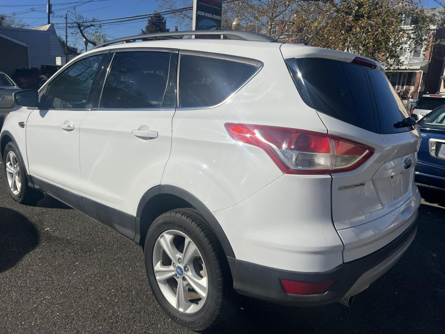 2013 White Ford Escape SE AWD (1FMCU9GXXDU) with an 1.6L L4 DOHC 16V engine, 6-Speed Automatic transmission, located at 1018 Brunswick Ave, Trenton, NJ, 08638, (609) 989-0900, 40.240086, -74.748085 - Photo#4