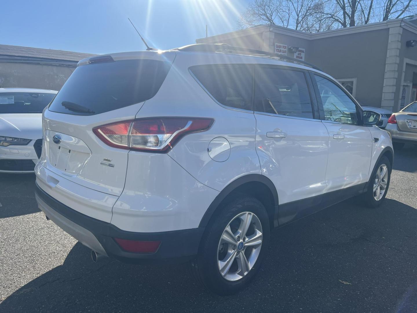 2013 White Ford Escape SE AWD (1FMCU9GXXDU) with an 1.6L L4 DOHC 16V engine, 6-Speed Automatic transmission, located at 1018 Brunswick Ave, Trenton, NJ, 08638, (609) 989-0900, 40.240086, -74.748085 - Photo#6