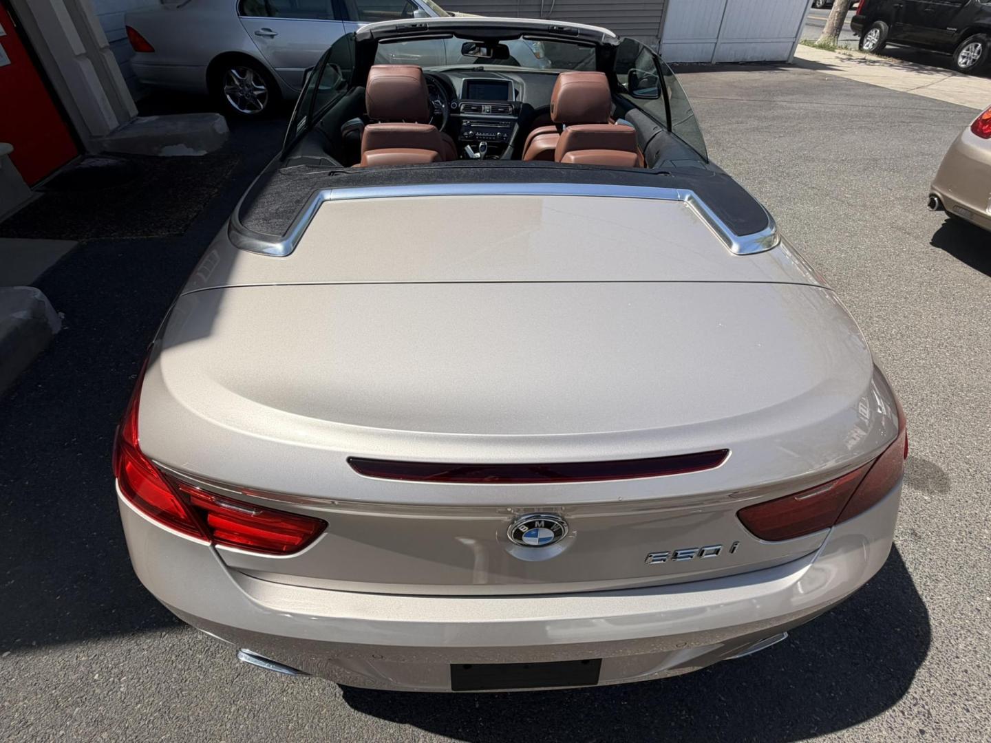 2012 Gold /Tan Leather BMW 6-Series 650i Convertible (WBALZ5C54CC) with an 4.4L V8 DOHC 32V TURBO engine, 6-Speed Manual transmission, located at 1018 Brunswick Ave, Trenton, NJ, 08638, (609) 989-0900, 40.240086, -74.748085 - Convertible season is here! This car is ready for the sun and ready for someone to own this beauty! Regularly maintained throughout its time, this vehicle will go the distance! If you are looking for a second car or summer toy, this BMW 650i is perfect for the price! Please call Anthony to set up a - Photo#17