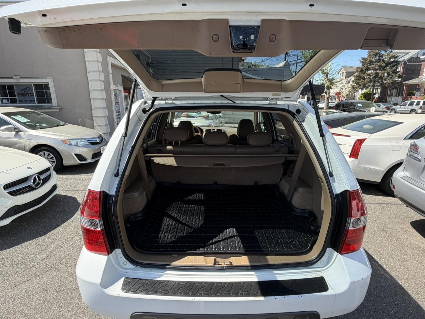 2003 White /Tan Leather Acura MDX Touring with Rear DVD System (2HNYD18733H) with an 3.5L V6 SOHC 24V engine, 5-Speed Automatic Overdrive transmission, located at 1018 Brunswick Ave, Trenton, NJ, 08638, (609) 989-0900, 40.240086, -74.748085 - This Touring model MDX is loaded up and super clean w so much great service history! You can buy this SUV w confidence. A great price for this reliable Acura. A must see and drive ASAP, please call Anthony to set up an appt. 609-273-5100 - Photo#4