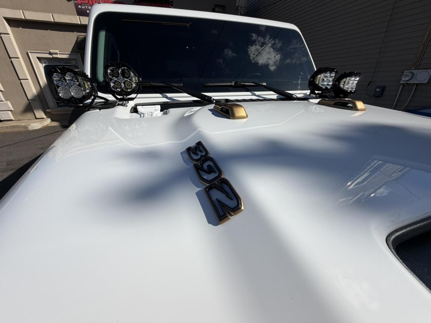 2024 White /Red Jeep Wrangler Rubicon 392 (1C4RJXSJ4RW) with an 6.4L V8 DOHC 32V engine, 6M transmission, located at 1018 Brunswick Ave, Trenton, NJ, 08638, (609) 989-0900, 40.240086, -74.748085 - WOW! WOW! WOW! This Rubicon is one Badass Jeep! Loaded w options and close to $20k in custom upgrades including LED Baja Design Lights, Borla exhaust, 20" Fuel wheels on 37" tires, custom front bumper and power dropdown running boards! This Jeep has been fully ceramic coated and tinted w/ windshield - Photo#4
