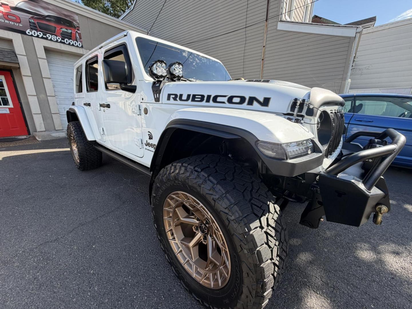 2024 White /Red Jeep Wrangler Rubicon 392 (1C4RJXSJ4RW) with an 6.4L V8 DOHC 32V engine, 6M transmission, located at 1018 Brunswick Ave, Trenton, NJ, 08638, (609) 989-0900, 40.240086, -74.748085 - WOW! WOW! WOW! This Rubicon is one Badass Jeep! Loaded w options and close to $20k in custom upgrades including LED Baja Design Lights, Borla exhaust, 20" Fuel wheels on 37" tires, custom front bumper and power dropdown running boards! This Jeep has been fully ceramic coated and tinted w/ windshield - Photo#1