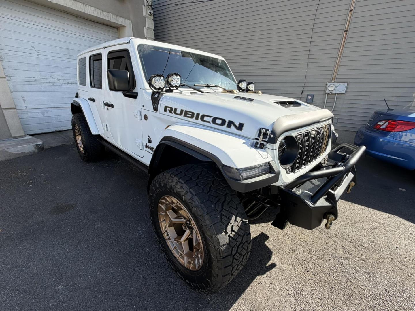 2024 White /Red Jeep Wrangler Rubicon 392 (1C4RJXSJ4RW) with an 6.4L V8 DOHC 32V engine, 6M transmission, located at 1018 Brunswick Ave, Trenton, NJ, 08638, (609) 989-0900, 40.240086, -74.748085 - WOW! WOW! WOW! This Rubicon is one Badass Jeep! Loaded w options and close to $20k in custom upgrades including LED Baja Design Lights, Borla exhaust, 20" Fuel wheels on 37" tires, custom front bumper and power dropdown running boards! This Jeep has been fully ceramic coated and tinted w/ windshield - Photo#11