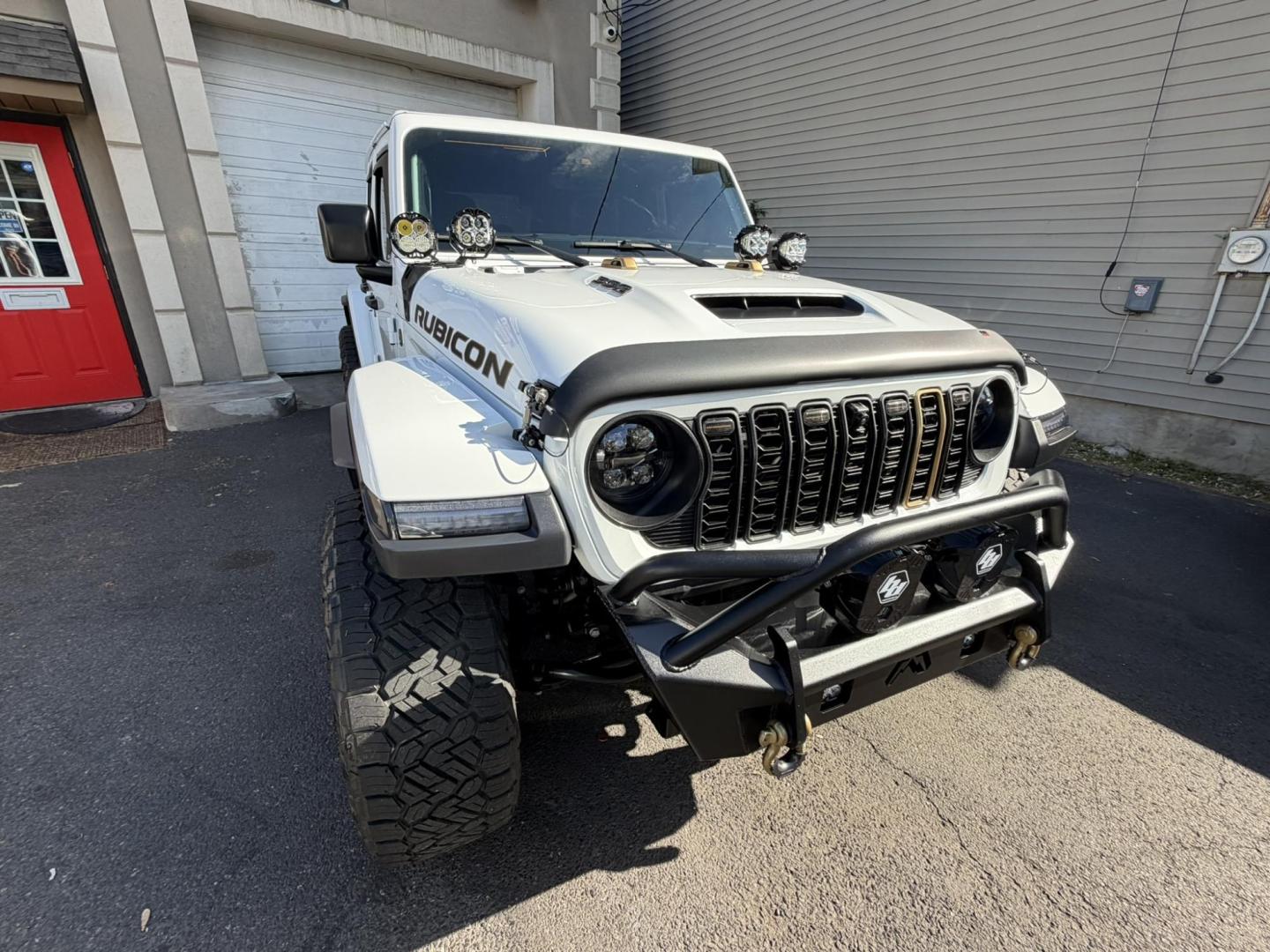 2024 White /Red Jeep Wrangler Rubicon 392 (1C4RJXSJ4RW) with an 6.4L V8 DOHC 32V engine, 6M transmission, located at 1018 Brunswick Ave, Trenton, NJ, 08638, (609) 989-0900, 40.240086, -74.748085 - WOW! WOW! WOW! This Rubicon is one Badass Jeep! Loaded w options and close to $20k in custom upgrades including LED Baja Design Lights, Borla exhaust, 20" Fuel wheels on 37" tires, custom front bumper and power dropdown running boards! This Jeep has been fully ceramic coated and tinted w/ windshield - Photo#13