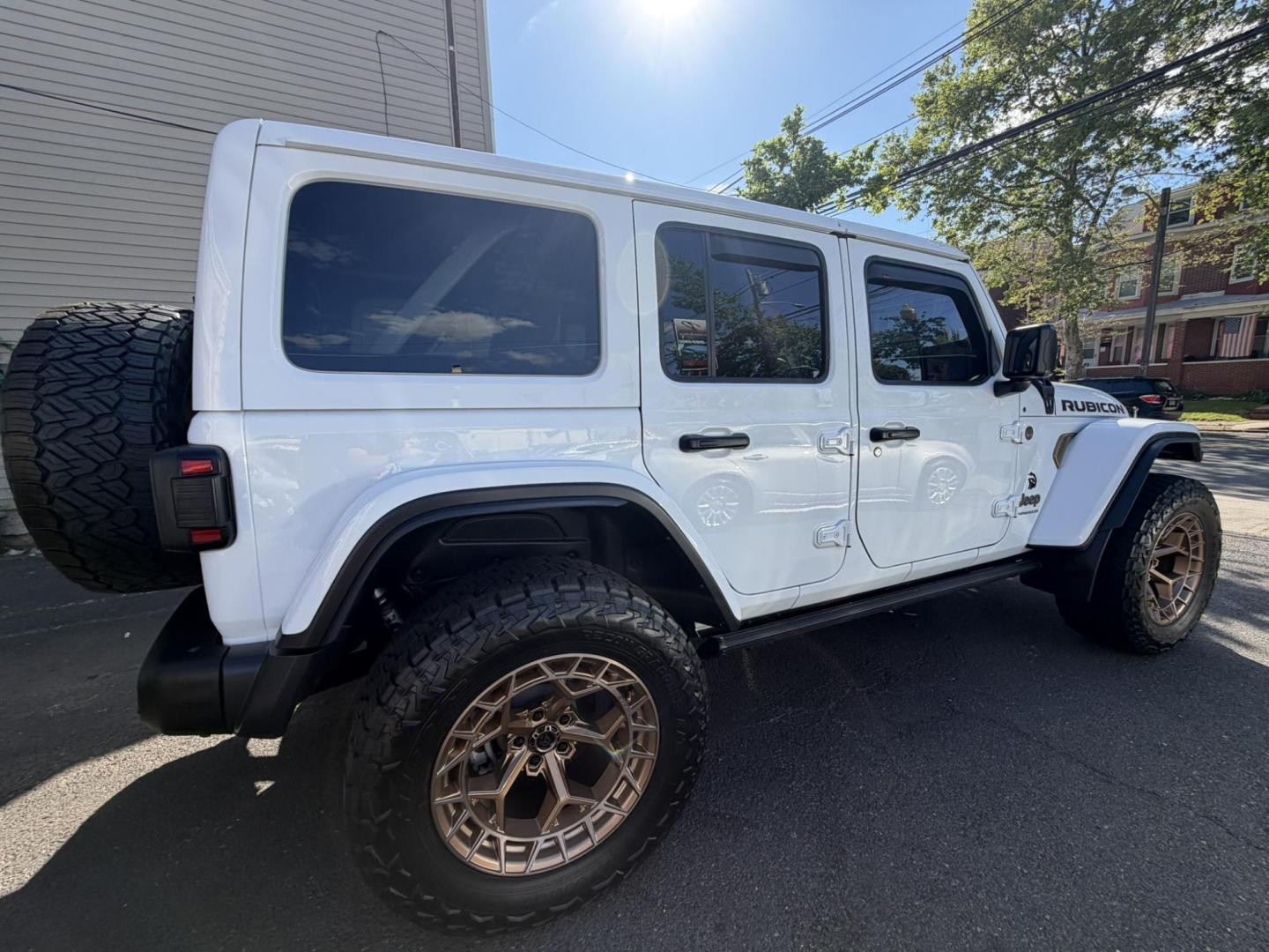 2024 White /Red Jeep Wrangler Rubicon 392 (1C4RJXSJ4RW) with an 6.4L V8 DOHC 32V engine, 6M transmission, located at 1018 Brunswick Ave, Trenton, NJ, 08638, (609) 989-0900, 40.240086, -74.748085 - WOW! WOW! WOW! This Rubicon is one Badass Jeep! Loaded w options and close to $20k in custom upgrades including LED Baja Design Lights, Borla exhaust, 20" Fuel wheels on 37" tires, custom front bumper and power dropdown running boards! This Jeep has been fully ceramic coated and tinted w/ windshield - Photo#2