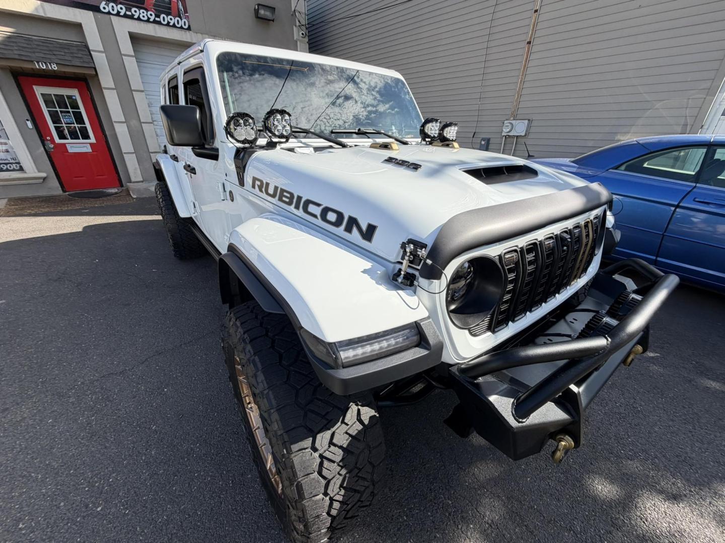 2024 White /Red Jeep Wrangler Rubicon 392 (1C4RJXSJ4RW) with an 6.4L V8 DOHC 32V engine, 6M transmission, located at 1018 Brunswick Ave, Trenton, NJ, 08638, (609) 989-0900, 40.240086, -74.748085 - WOW! WOW! WOW! This Rubicon is one Badass Jeep! Loaded w options and close to $20k in custom upgrades including LED Baja Design Lights, Borla exhaust, 20" Fuel wheels on 37" tires, custom front bumper and power dropdown running boards! This Jeep has been fully ceramic coated and tinted w/ windshield - Photo#19
