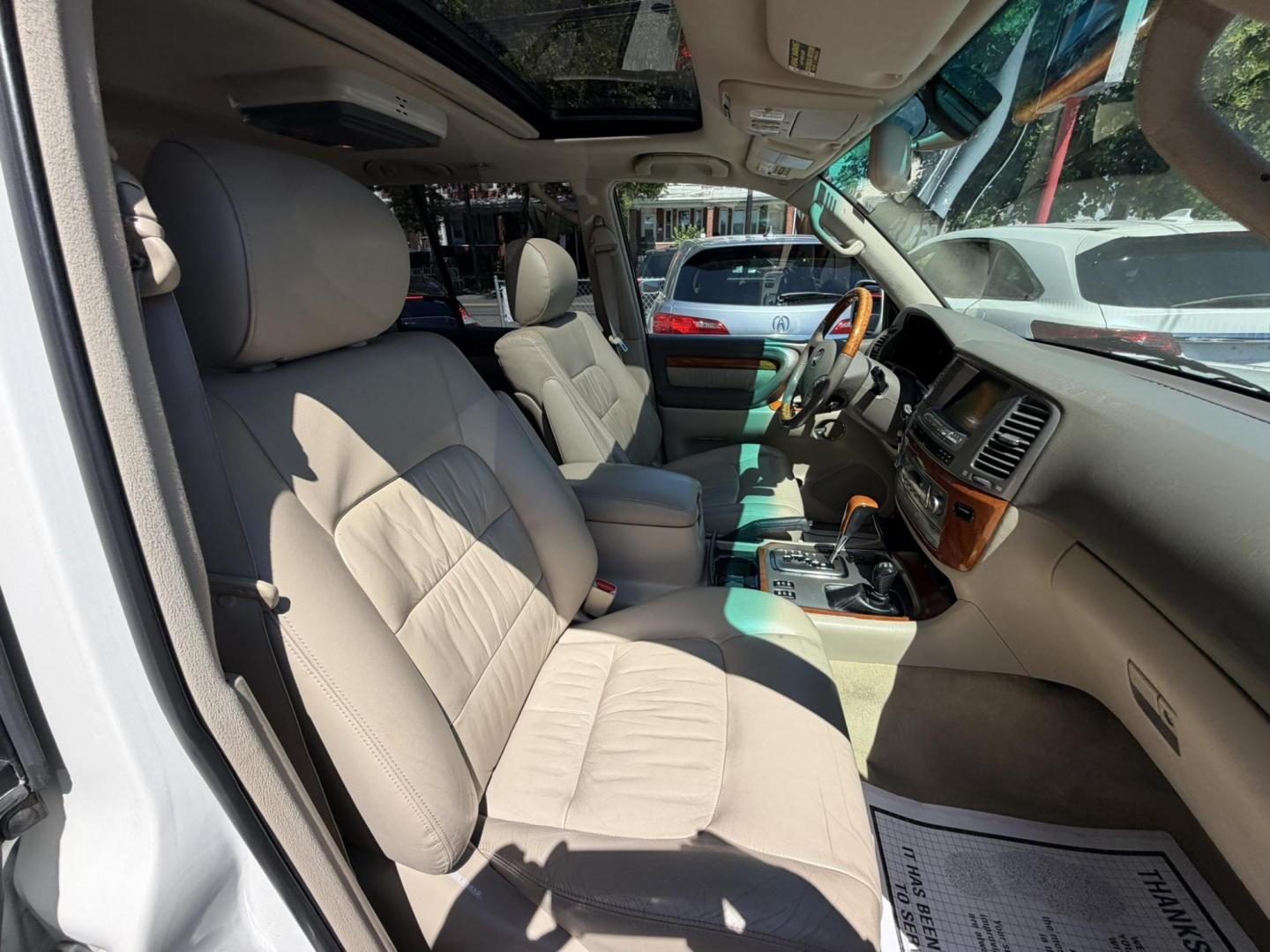 2004 White /Tan Leather Lexus LX 470 Sport Utility (JTJHT00W043) with an 4.7L V8 DOHC 32V engine, 5-Speed Automatic Overdrive transmission, located at 1018 Brunswick Ave, Trenton, NJ, 08638, (609) 989-0900, 40.240086, -74.748085 - Here is a really Rare 1 owner Lexus SUV! Freshly detailed and serviced and ready for another 100k or more miles! Lots of consistent service history on this LX470! Please call Anthony to set an appt. as this will not last long on the lot! 609-273-5100- Photo#62