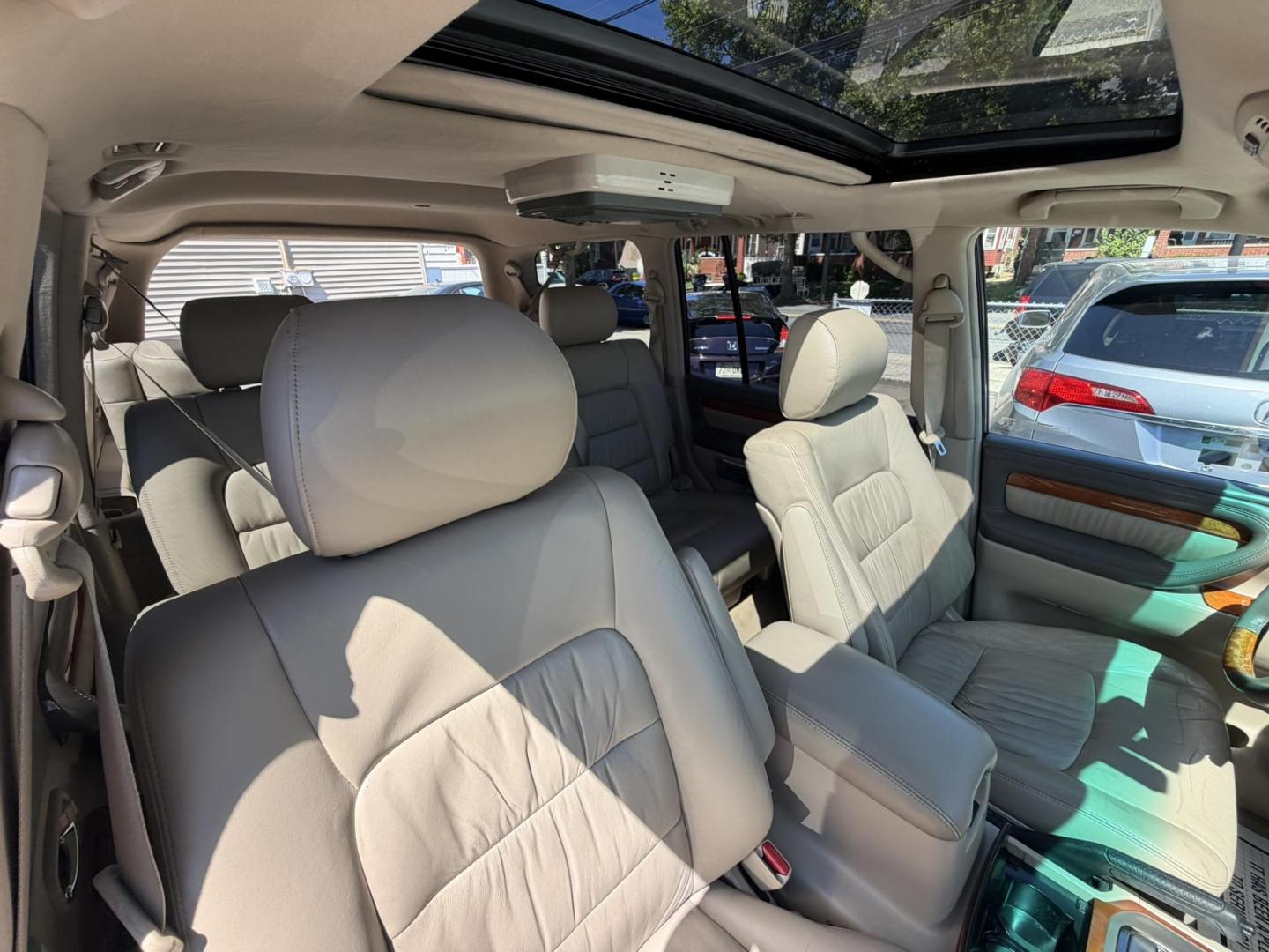 2004 White /Tan Leather Lexus LX 470 Sport Utility (JTJHT00W043) with an 4.7L V8 DOHC 32V engine, 5-Speed Automatic Overdrive transmission, located at 1018 Brunswick Ave, Trenton, NJ, 08638, (609) 989-0900, 40.240086, -74.748085 - Here is a really Rare 1 owner Lexus SUV! Freshly detailed and serviced and ready for another 100k or more miles! Lots of consistent service history on this LX470! Please call Anthony to set an appt. as this will not last long on the lot! 609-273-5100- Photo#63