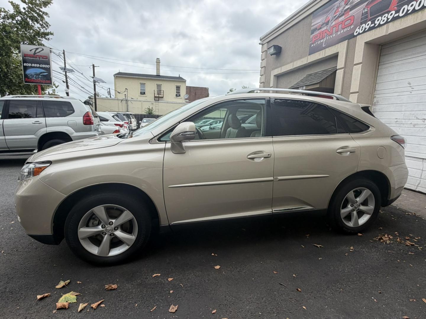2011 Gold /Tan Leather Lexus RX 350 AWD (2T2BK1BA9BC) with an 3.5L V6 DOHC 24V engine, 5A transmission, located at 1018 Brunswick Ave, Trenton, NJ, 08638, (609) 989-0900, 40.240086, -74.748085 - A really clean and well maintained Lexus RX, a must see and drive ASAP! Financing available, call Anthony to set up an appointment to see it, 609-273-5100- Photo#1