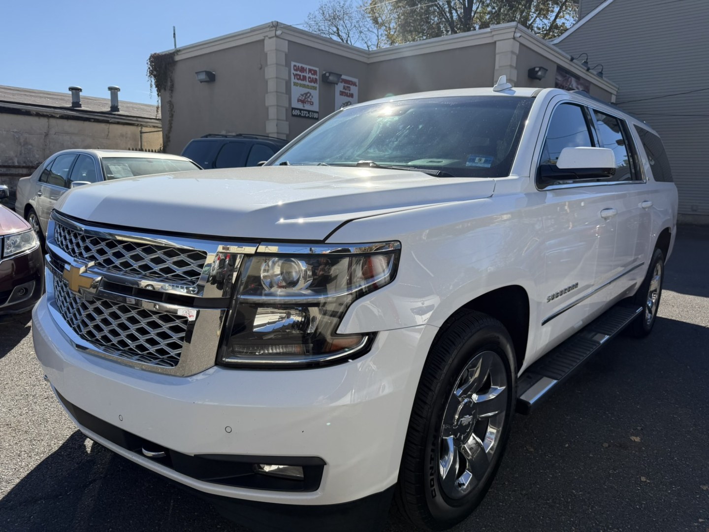 2018 White Chevrolet Suburban LT 4WD (1GNSKHKC8JR) with an 5.3L V8 OHV 16V engine, 6A transmission, located at 1018 Brunswick Ave, Trenton, NJ, 08638, (609) 989-0900, 40.240086, -74.748085- Photo#0